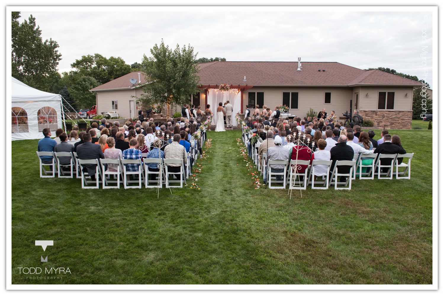 Philip-Cindy-St. Cloud-Wedding-Photography-Geyer-backyard-wedding-tent (24)