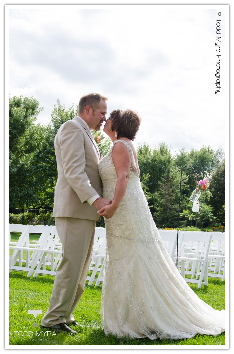 Philip-Cindy-St. Cloud-Wedding-Photography-Geyer-backyard-wedding-tent (5)