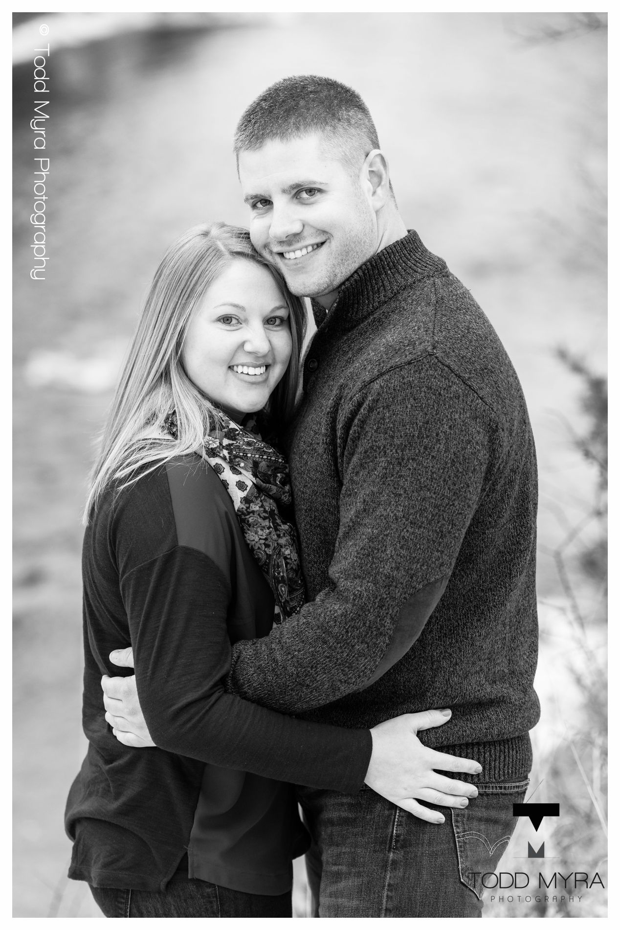 10 -St-Cloud-Wedding-Engagement-snow-river-football-mikki-shane