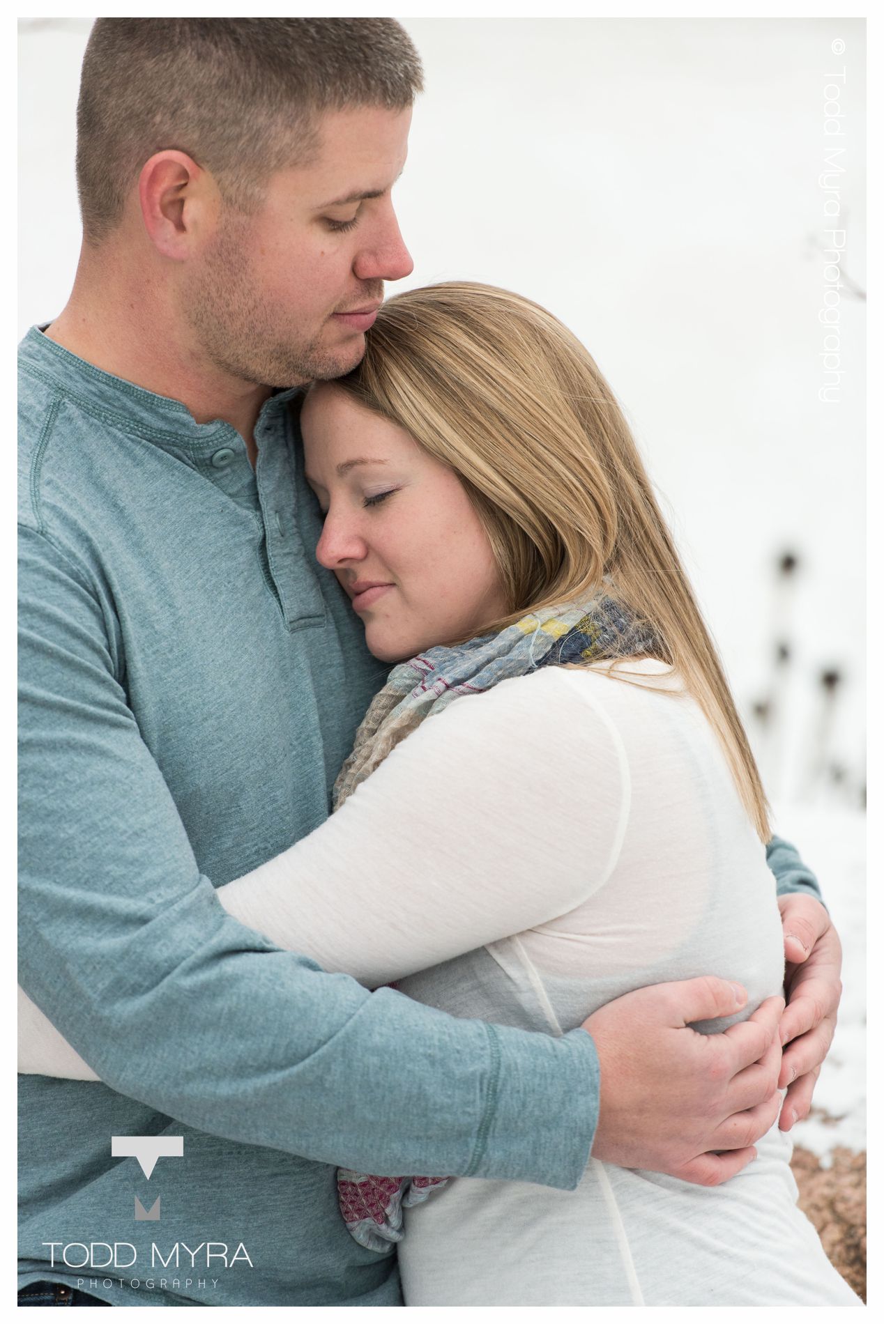 12 -St-Cloud-Wedding-Engagement-snow-river-football-mikki-shane