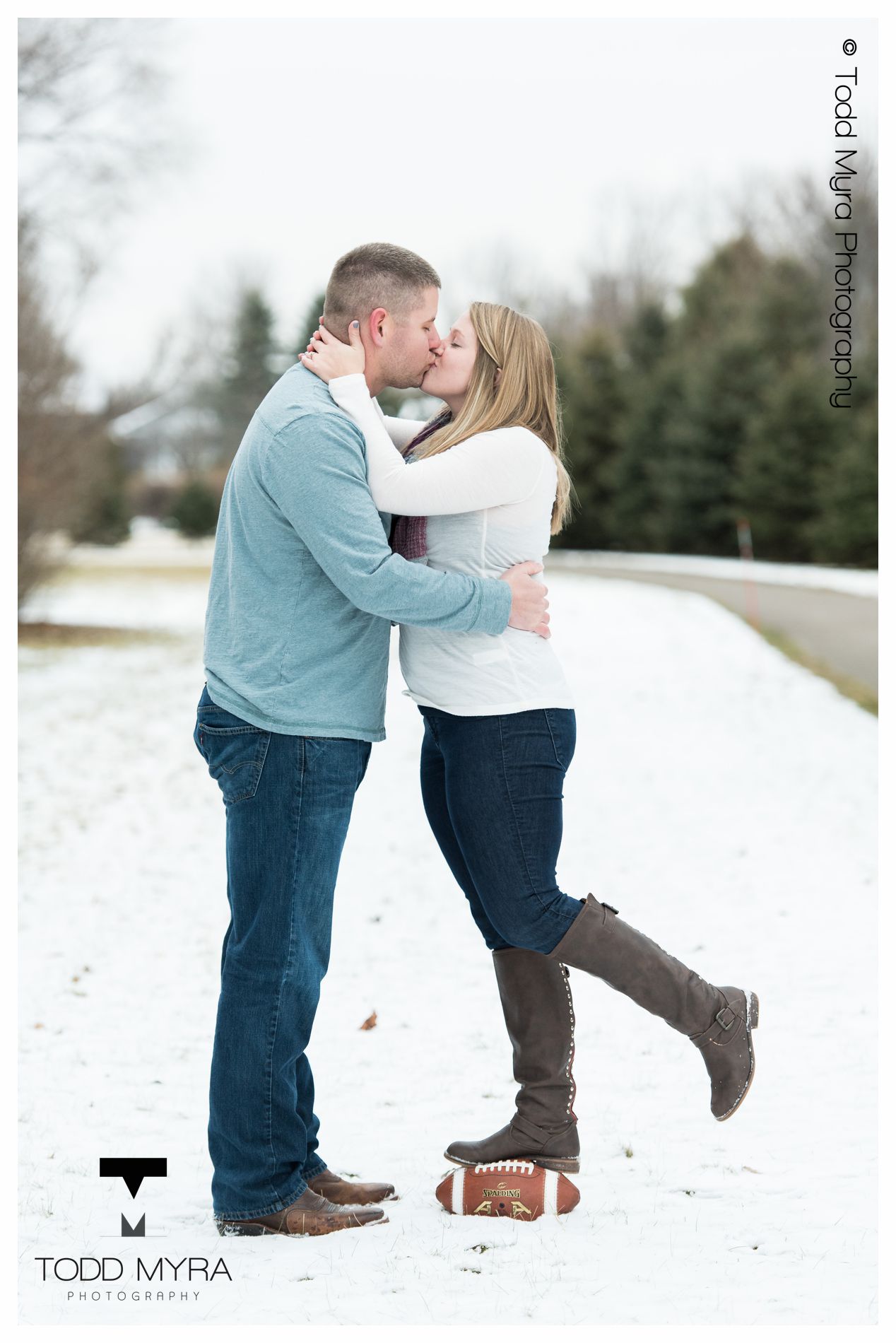 15 -St-Cloud-Wedding-Engagement-snow-river-football-mikki-shane