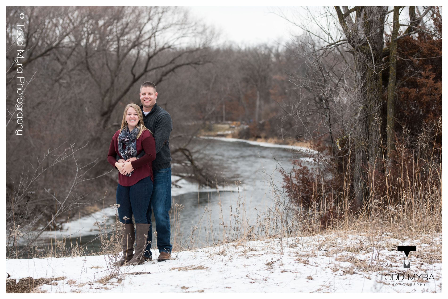 8 -St-Cloud-Wedding-Engagement-snow-river-football-mikki-shane
